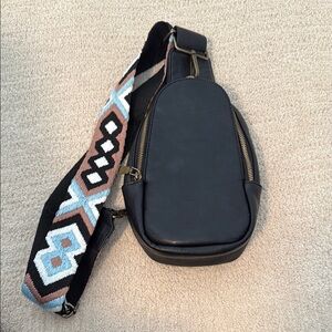 Stylish Black Sling Bag with Patterned Strap